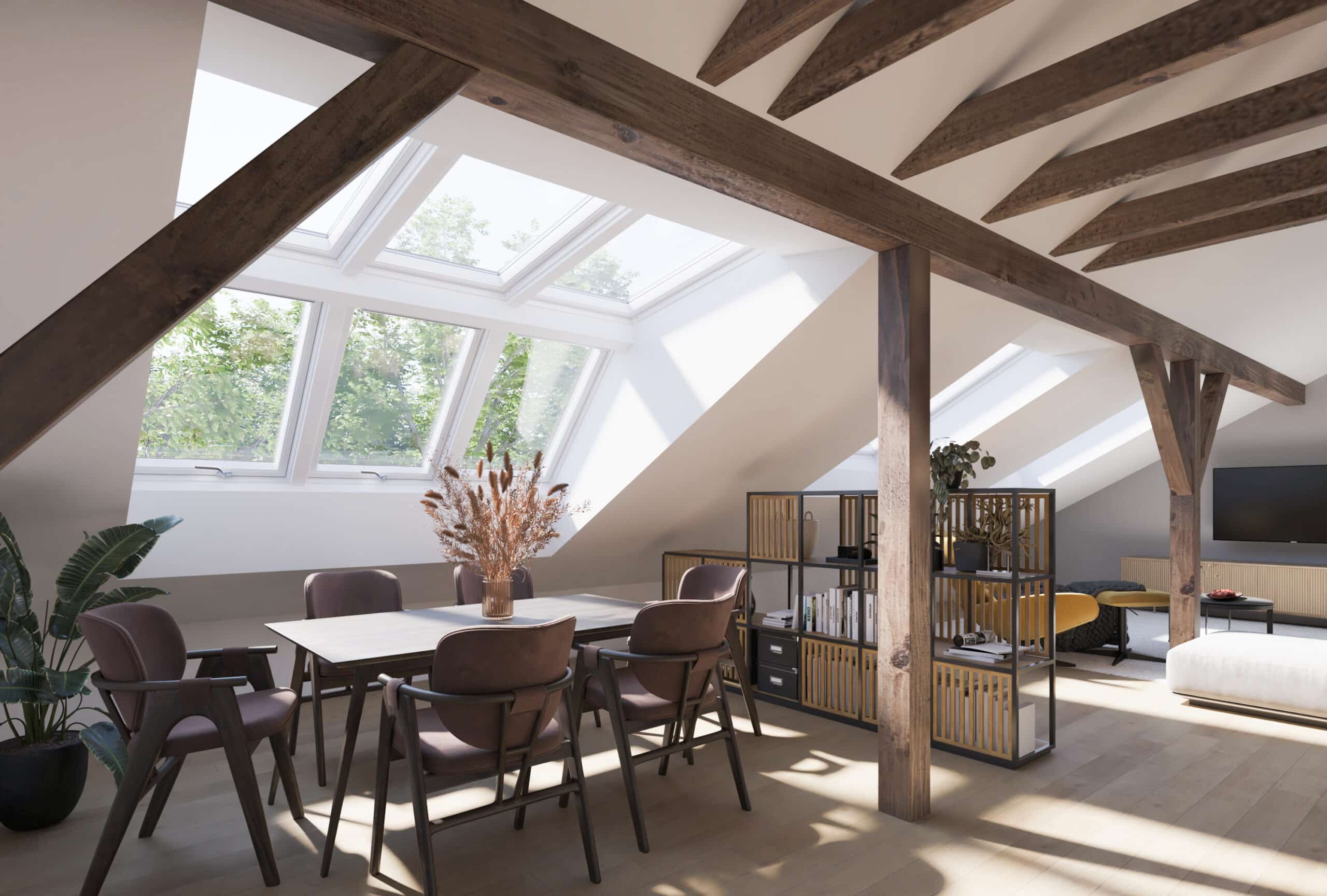 Studio mansard&eacute; sous les combles avec fen&ecirc;tres de toit VELUX et poutres en bois.