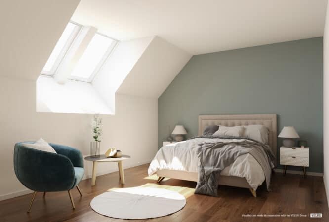 Chambre mansardée avec plafond incliné et fenêtre de toit VELUX, confortable et lumineuse.