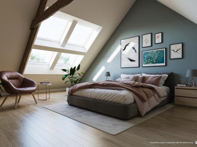 Chambre mansardée avec plafond incliné et fenêtre de toit VELUX, confortable et lumineuse.