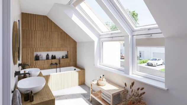Salle de bains mansardée moderne avec plafond incliné et grandes fenêtres de toit VELUX, accents en bois.