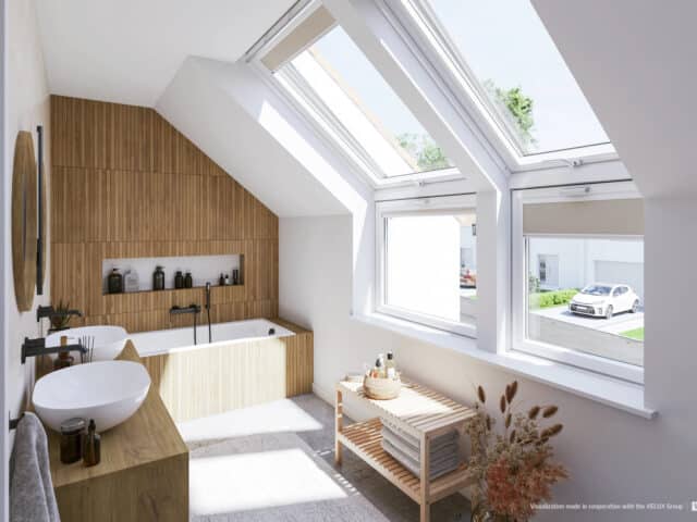 Salle de bains mansardée moderne avec plafond incliné et grandes fenêtres de toit VELUX, accents en bois.