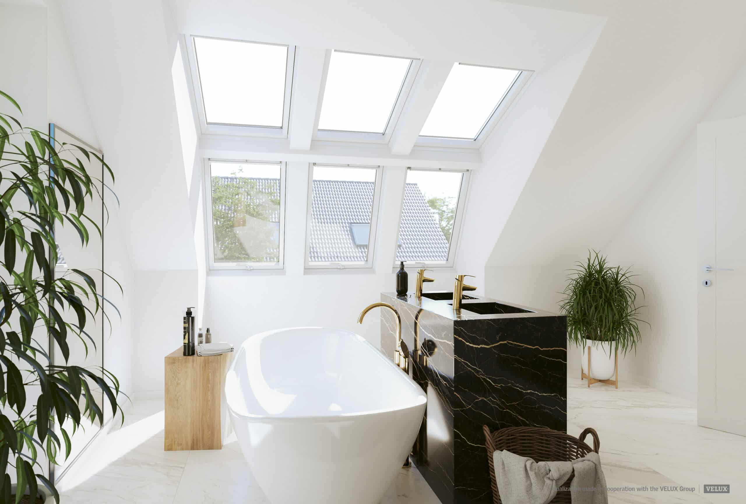Salle de bains sous pente avec fen&ecirc;tres de toit VELUX, baignoire et lavabo en marbre.