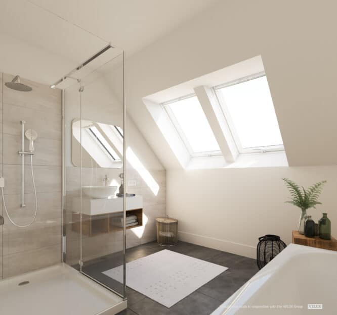 Salle de bains avec douche et baignoire dans les combles avec des fenêtres de toit VELUX
