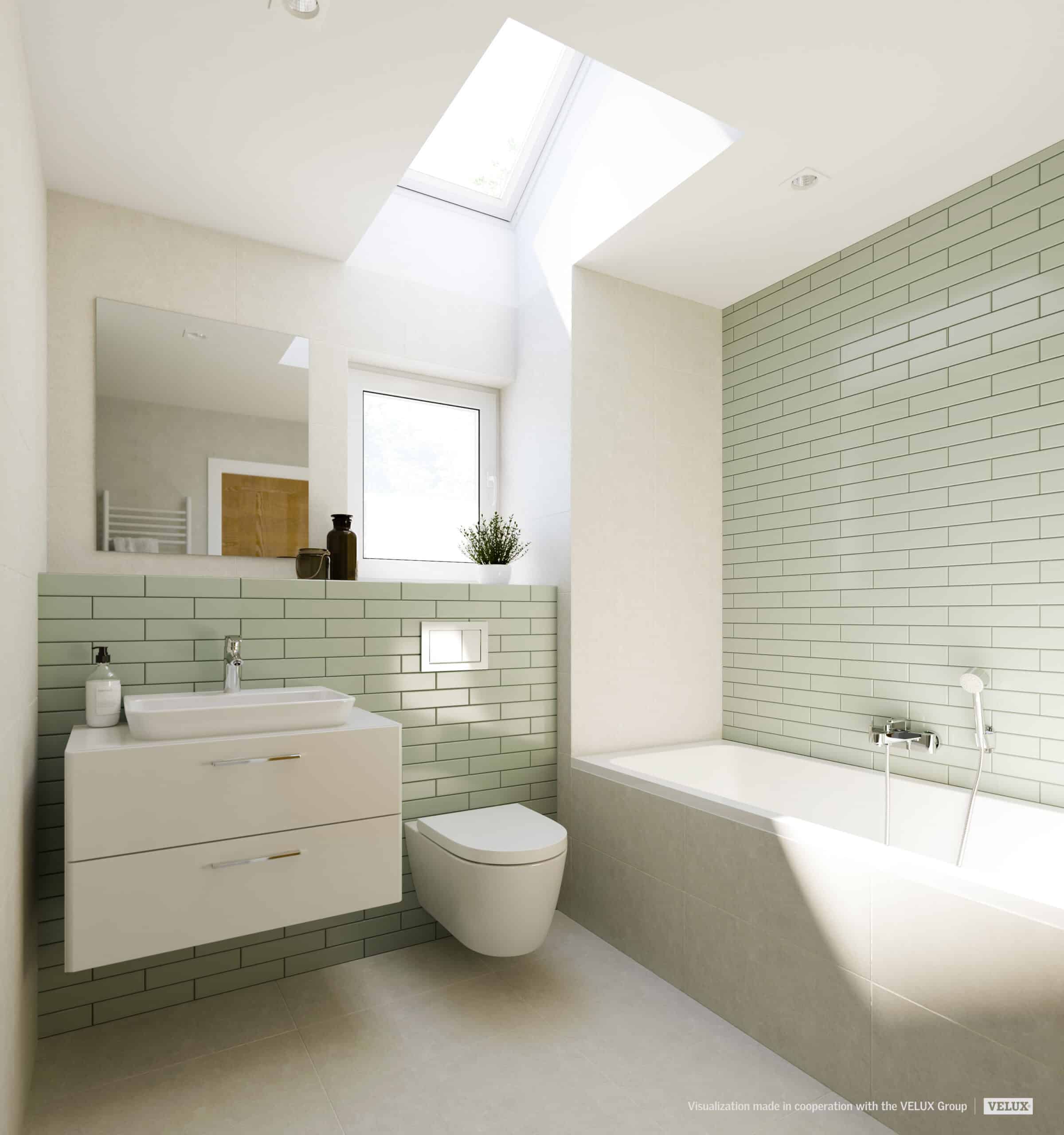 Salle de bains moderne sous pente avec fen&ecirc;tre de toit VELUX, carrelage vert clair et &eacute;quipements blancs.