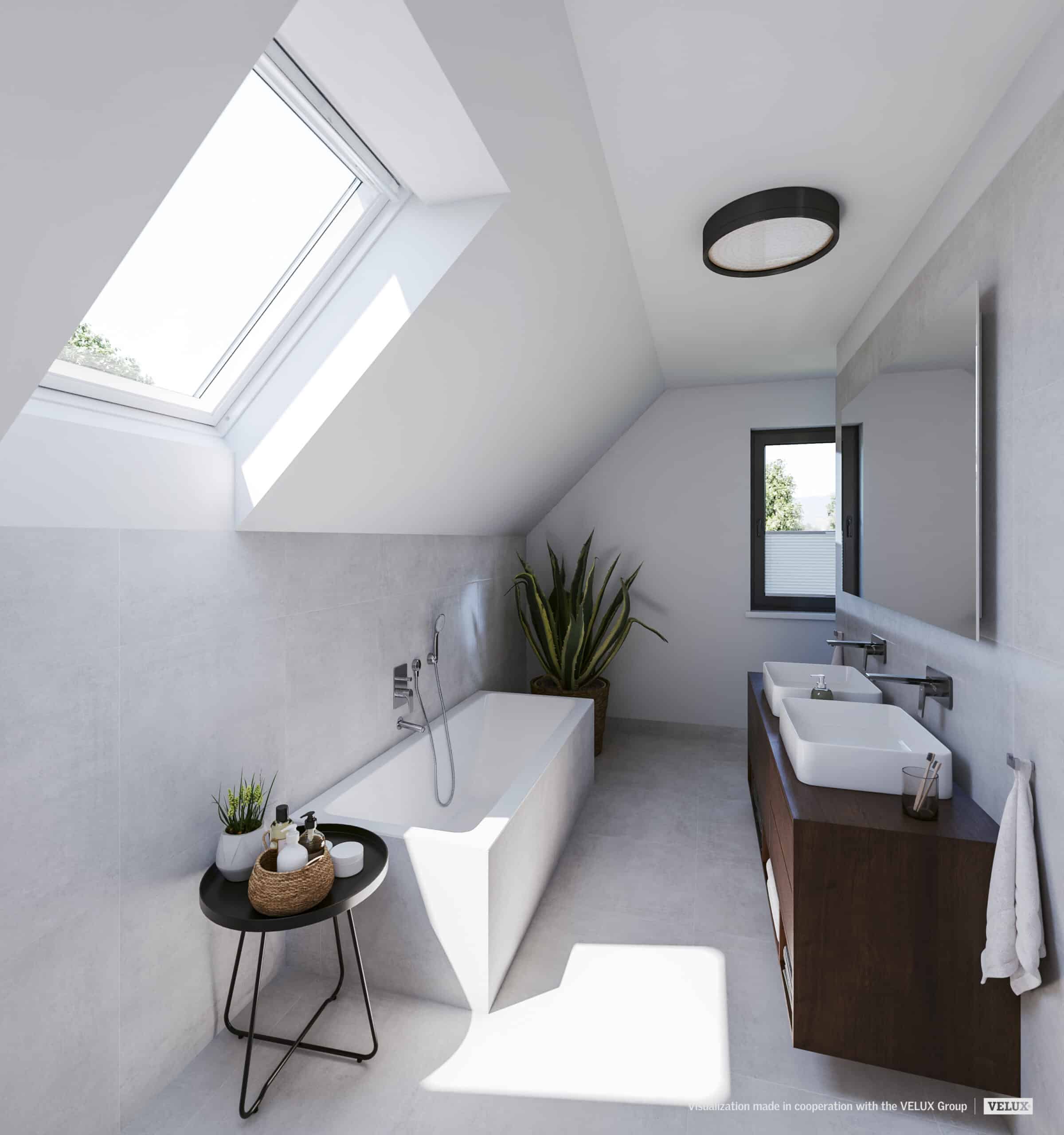 Salle de bains sous combles avec plafond en pente et fen&ecirc;tre de toit VELUX, &eacute;quipements modernes.