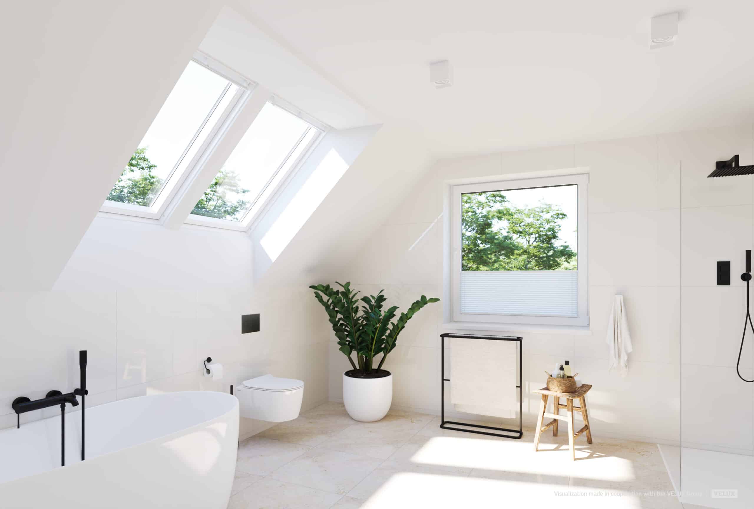 Salle de bains moderne avec fen&ecirc;tre de toit VELUX, baignoire et espace douche.