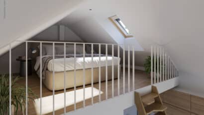 Chambre mansardée avec plafond en pente et fenêtre de toit VELUX, baignée de lumière naturelle.