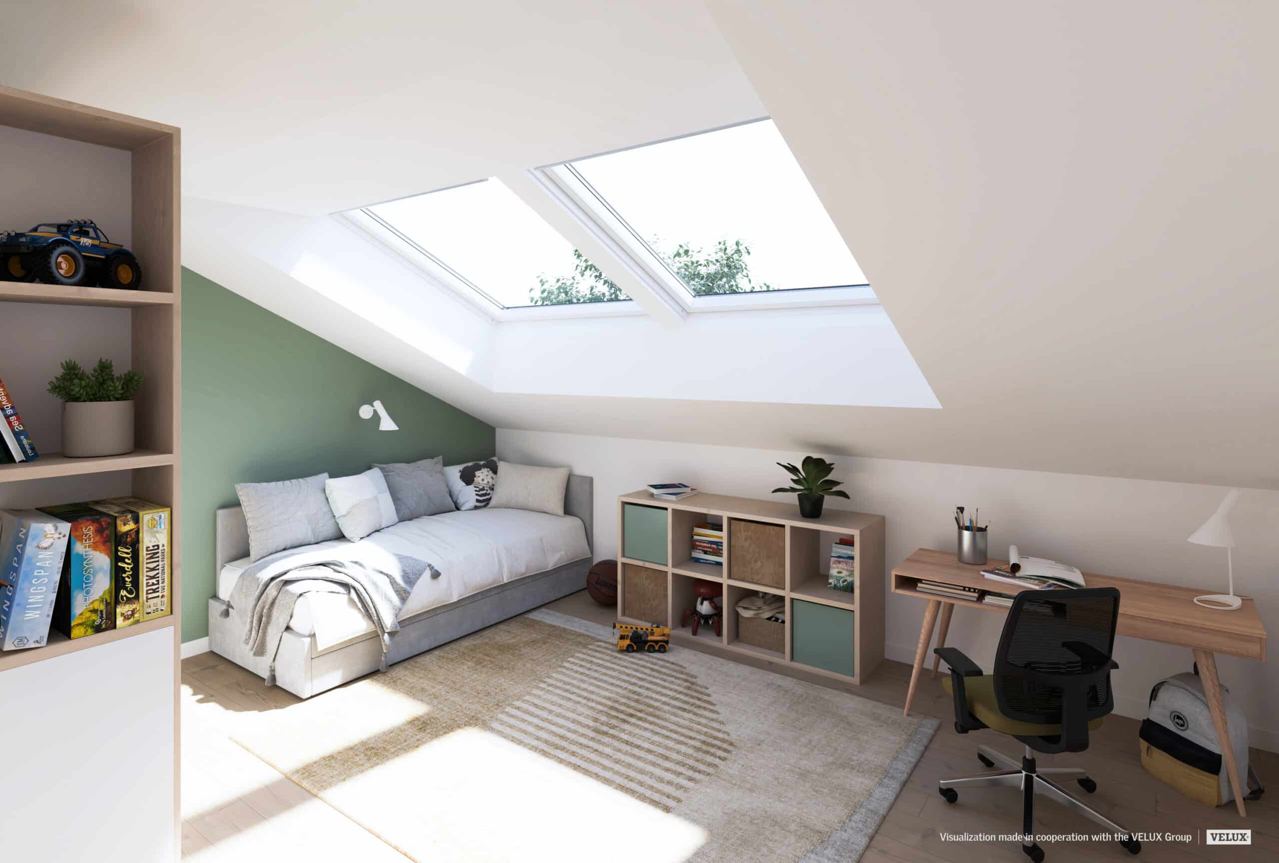 Chambre sous les combles avec plafond en pente et fen&ecirc;tres de toit VELUX.