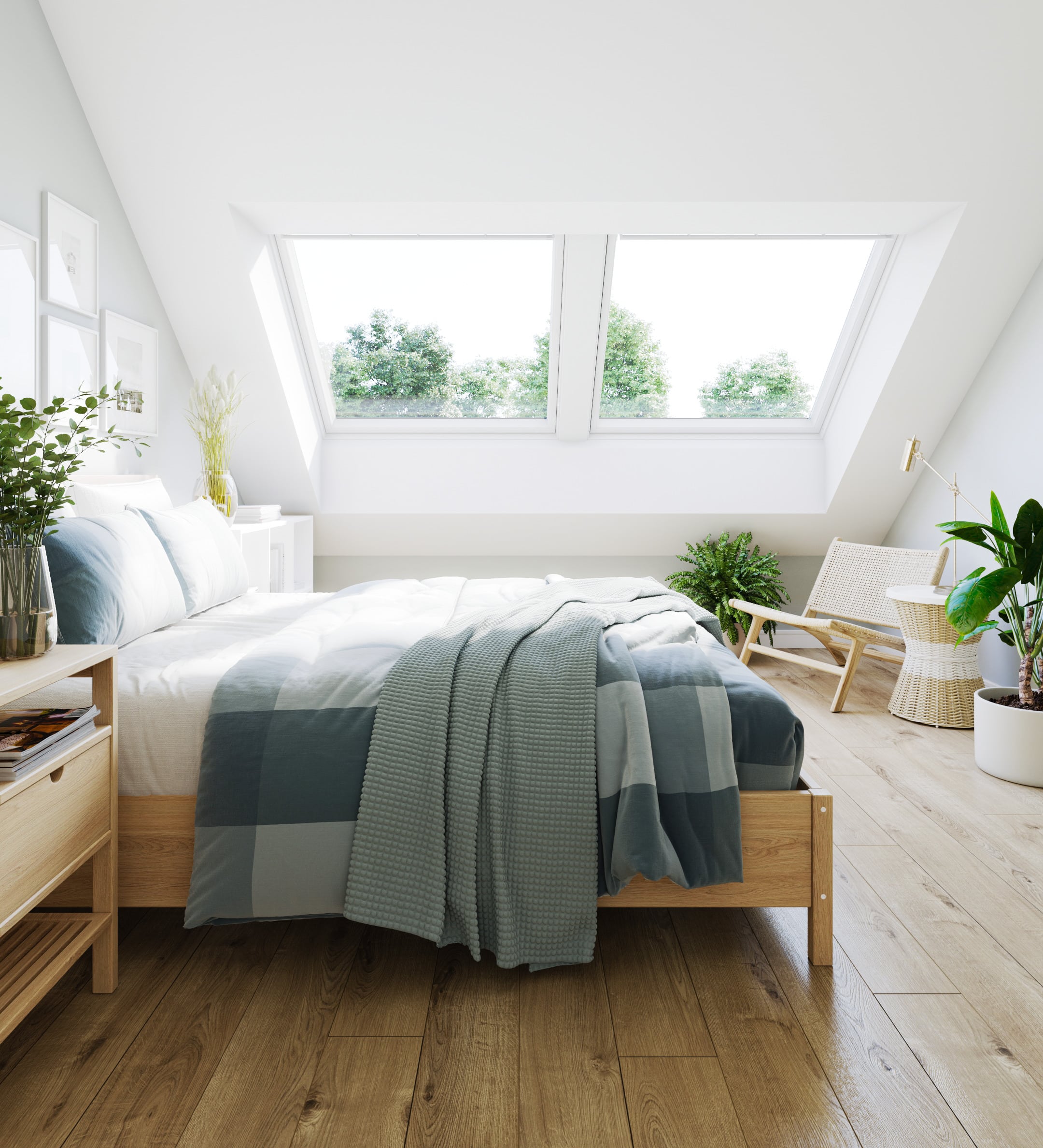 Chambre sous les combles avec plafond en pente et grande fen&ecirc;tre de toit VELUX laissant entrer la lumi&egrave;re naturelle.