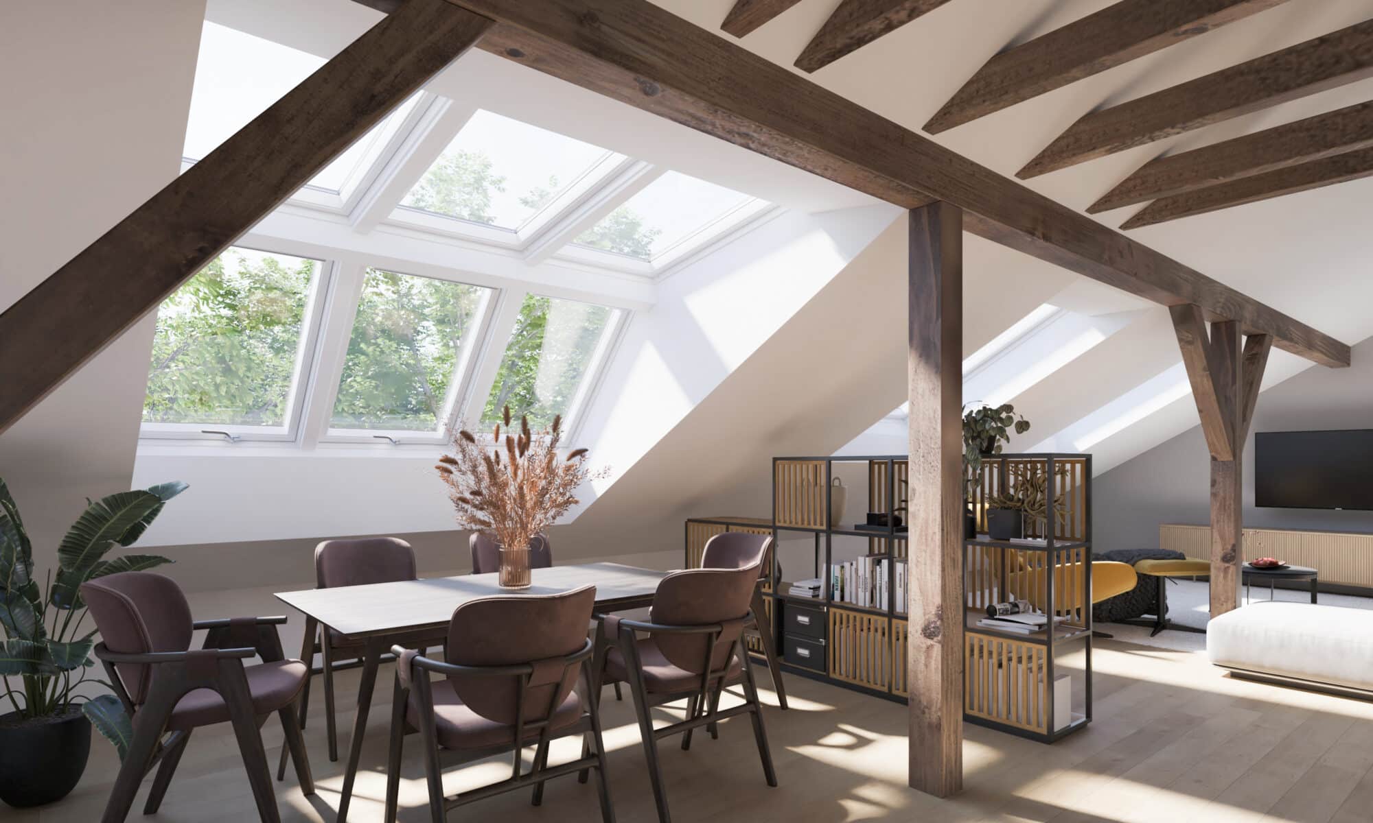 Chambre mansardée avec fenêtres de toit VELUX et poutres apparentes.