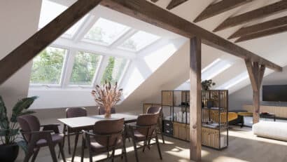 Chambre mansardée avec fenêtres de toit VELUX et poutres apparentes.