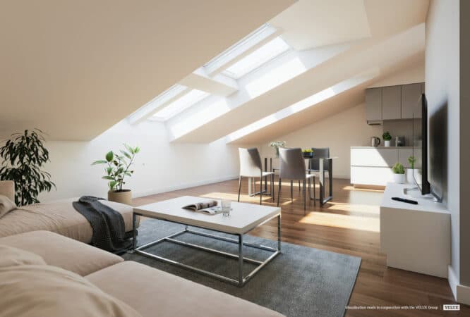 Espace de vie mansardé avec plafond incliné et fenêtres de toit VELUX, lumineux et aéré.