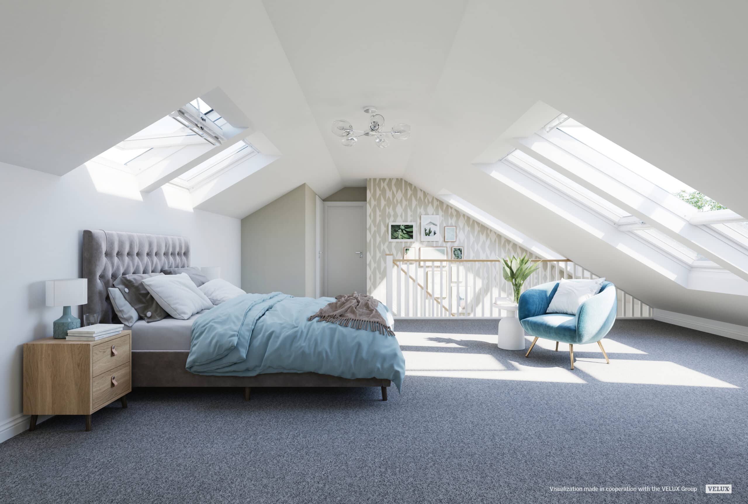 Chambre mansardée avec plafond en pente et fenêtres de toit VELUX, un espace lumineux et aéré.