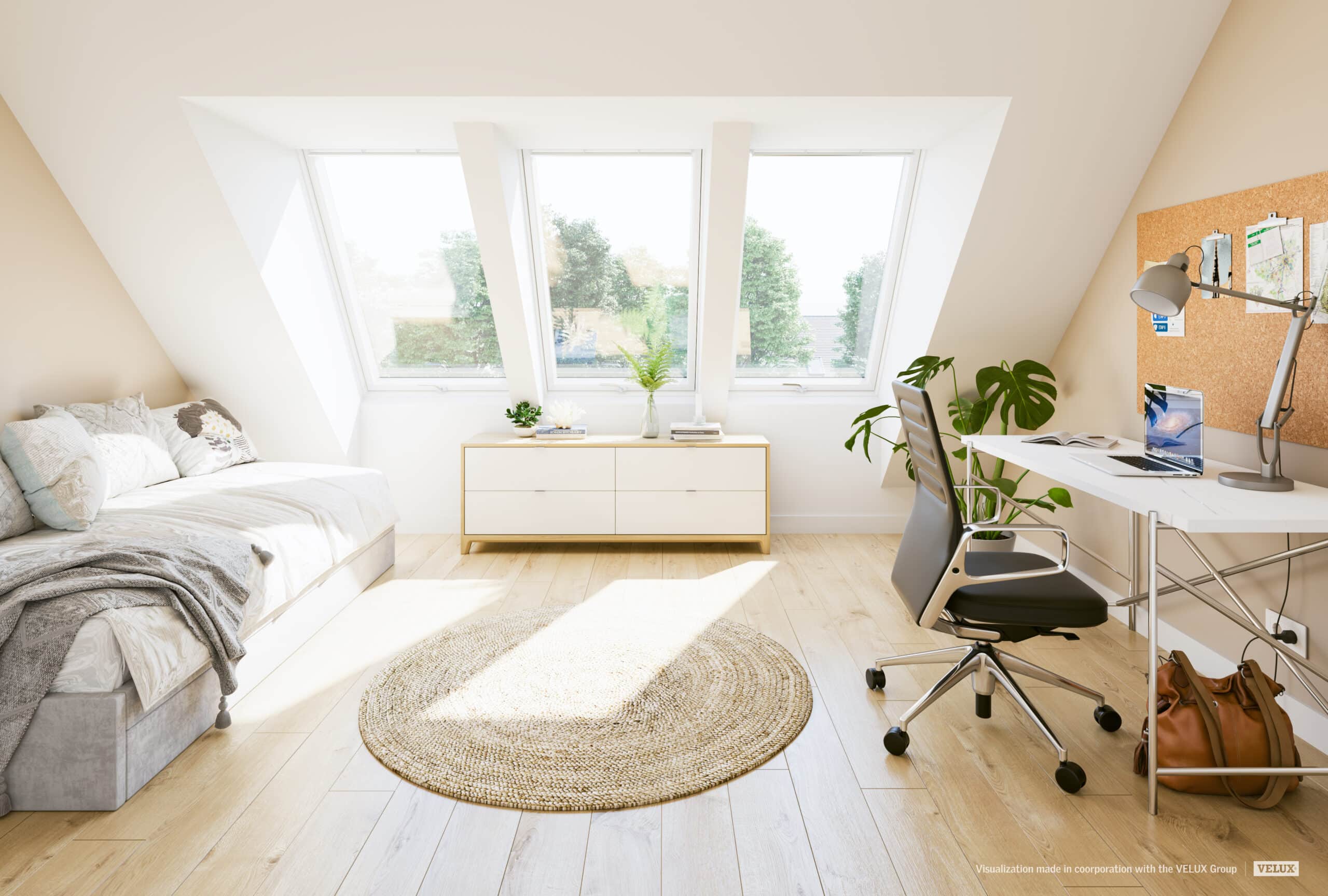 Bureau aménagé sous les combles avec fenêtres de toit VELUX, bureau, banquette-lit et lumière naturelle.