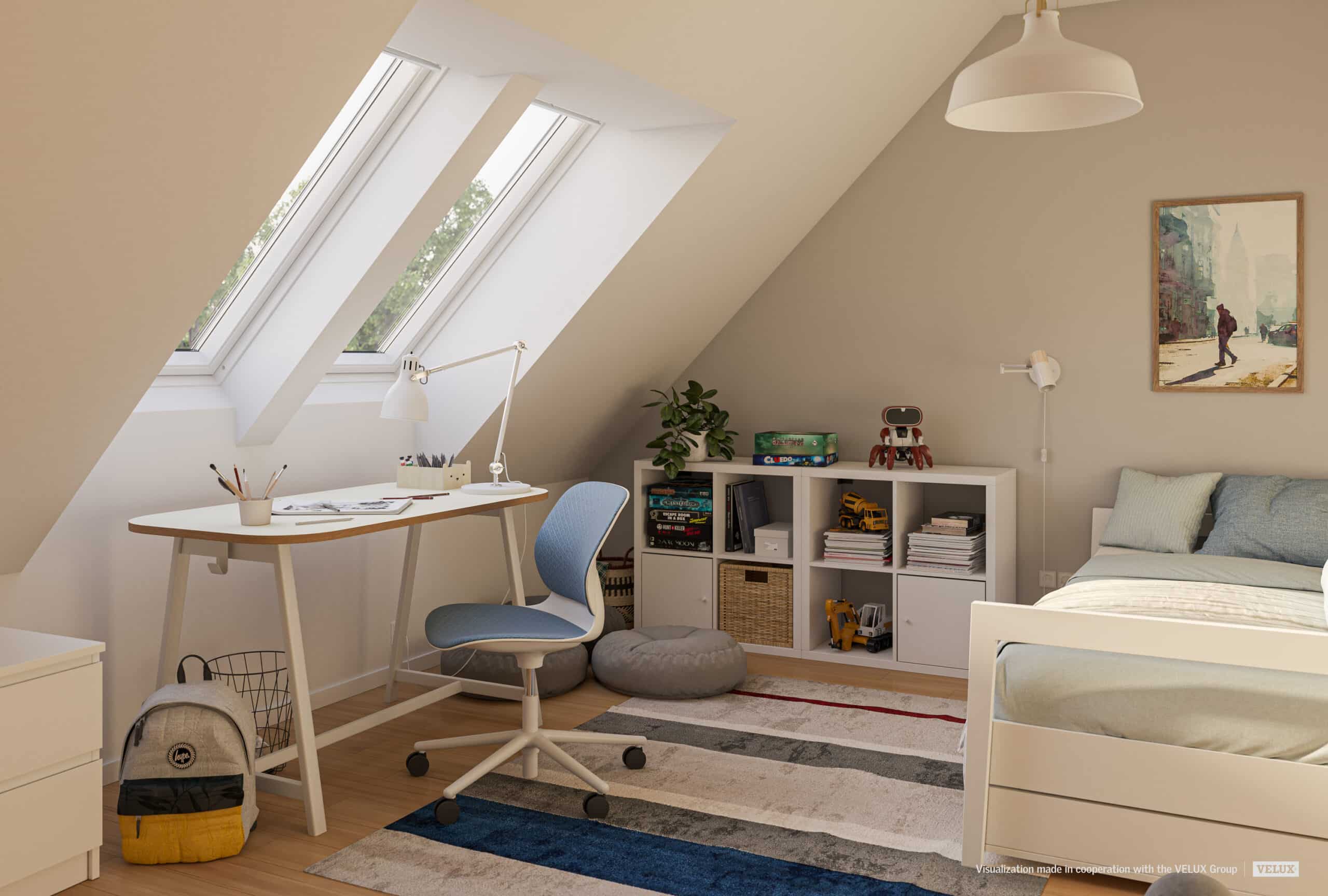Chambre d'adolescent sous les combles avec coin bureau, plafond en pente et fen&ecirc;tres de toit VELUX.