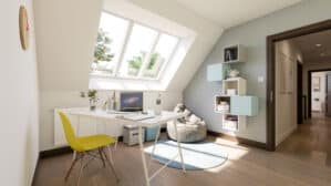 Bureau à domicile sous combles avec plafond en pente et fenêtre de toit VELUX, lumineux et aéré.
